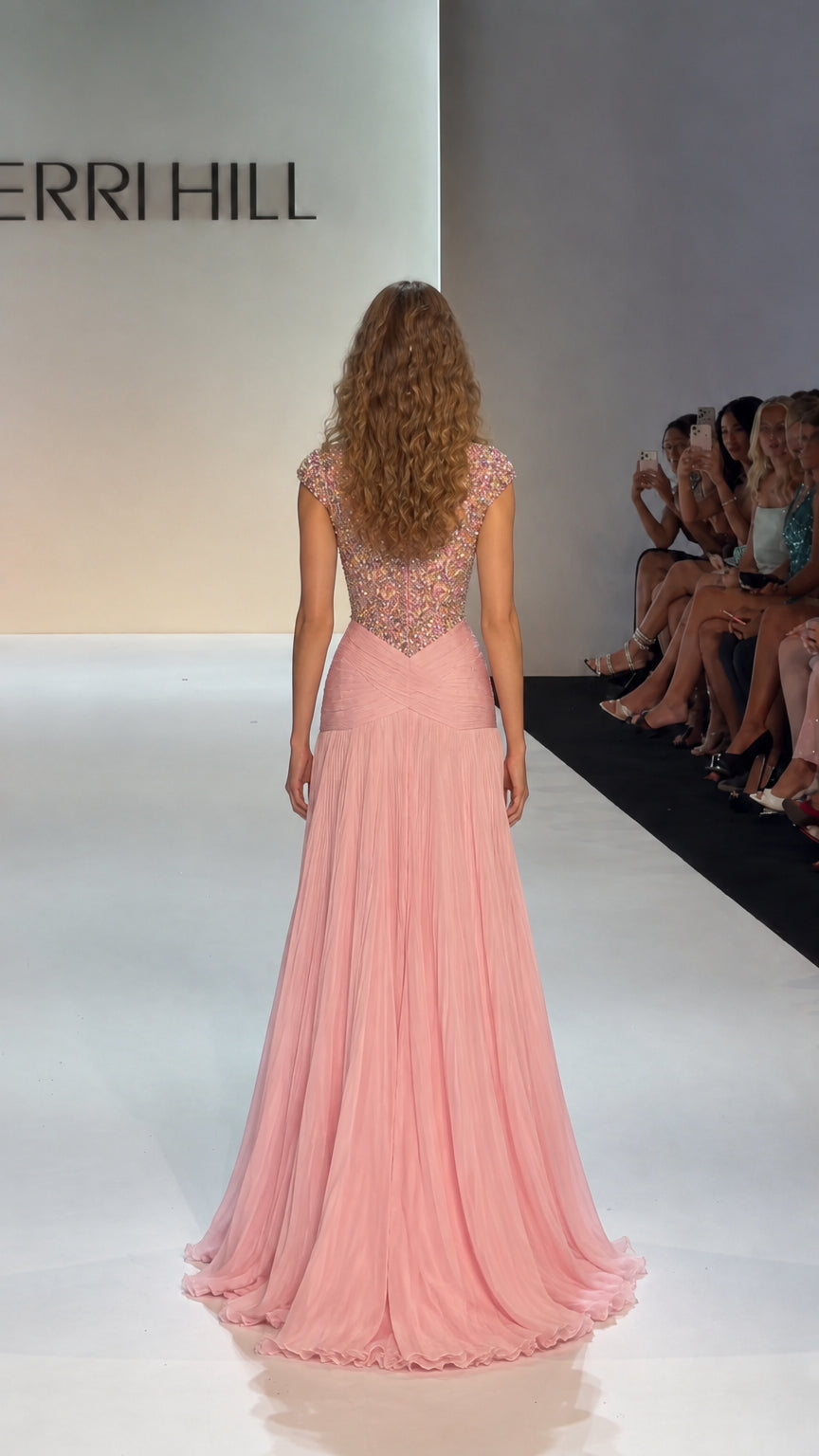 Back view of blush pink floor-length beaded evening gown with pleated skirt