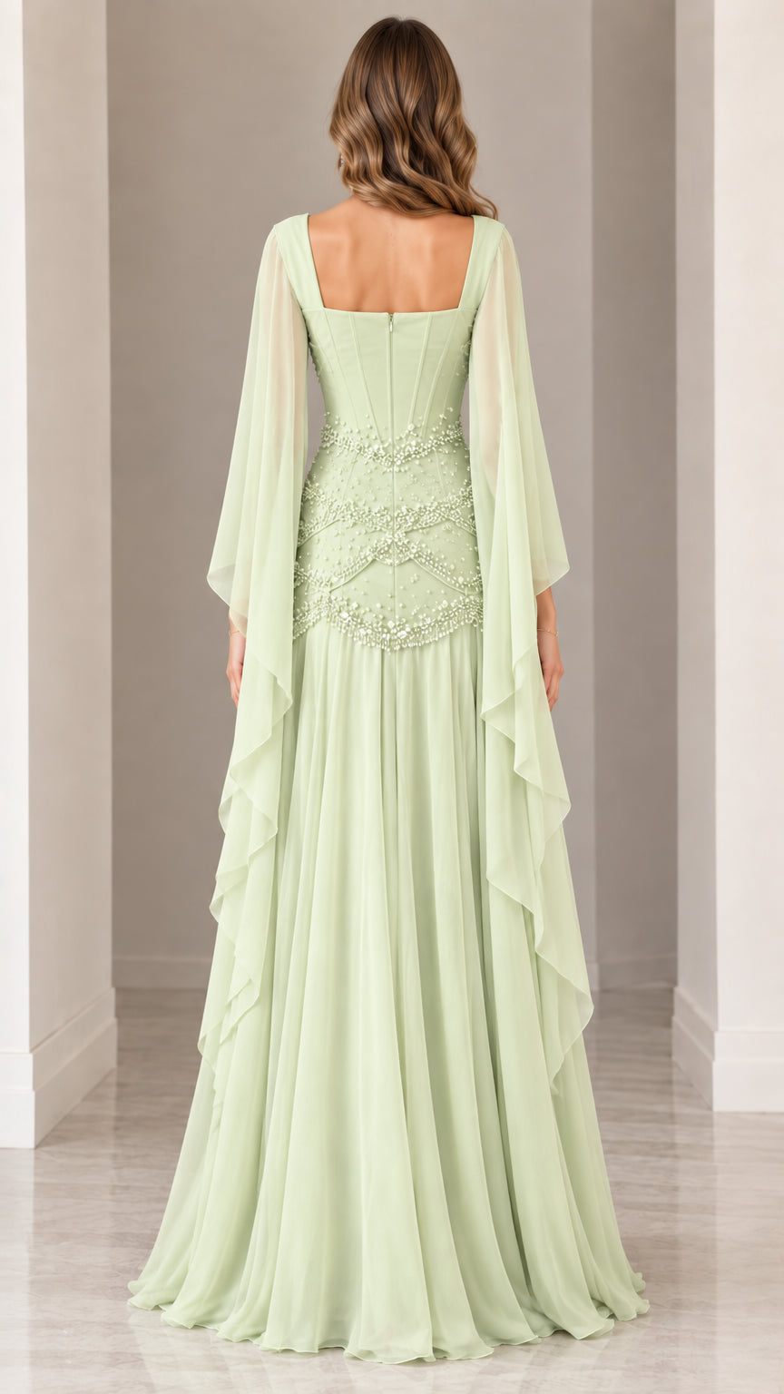Back view of sage green beaded formal evening gown with long sheer drape sleeves