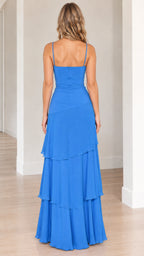 Back view of model in royal blue floor-length dress showing low back and zipper