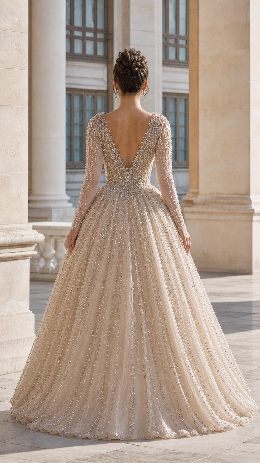 Back view of champagne formal evening gown showing deep V-back design