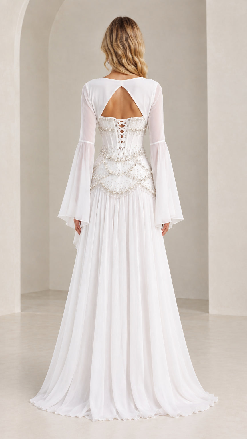 White evening gown back view showing lace-up corset and bolero shrug