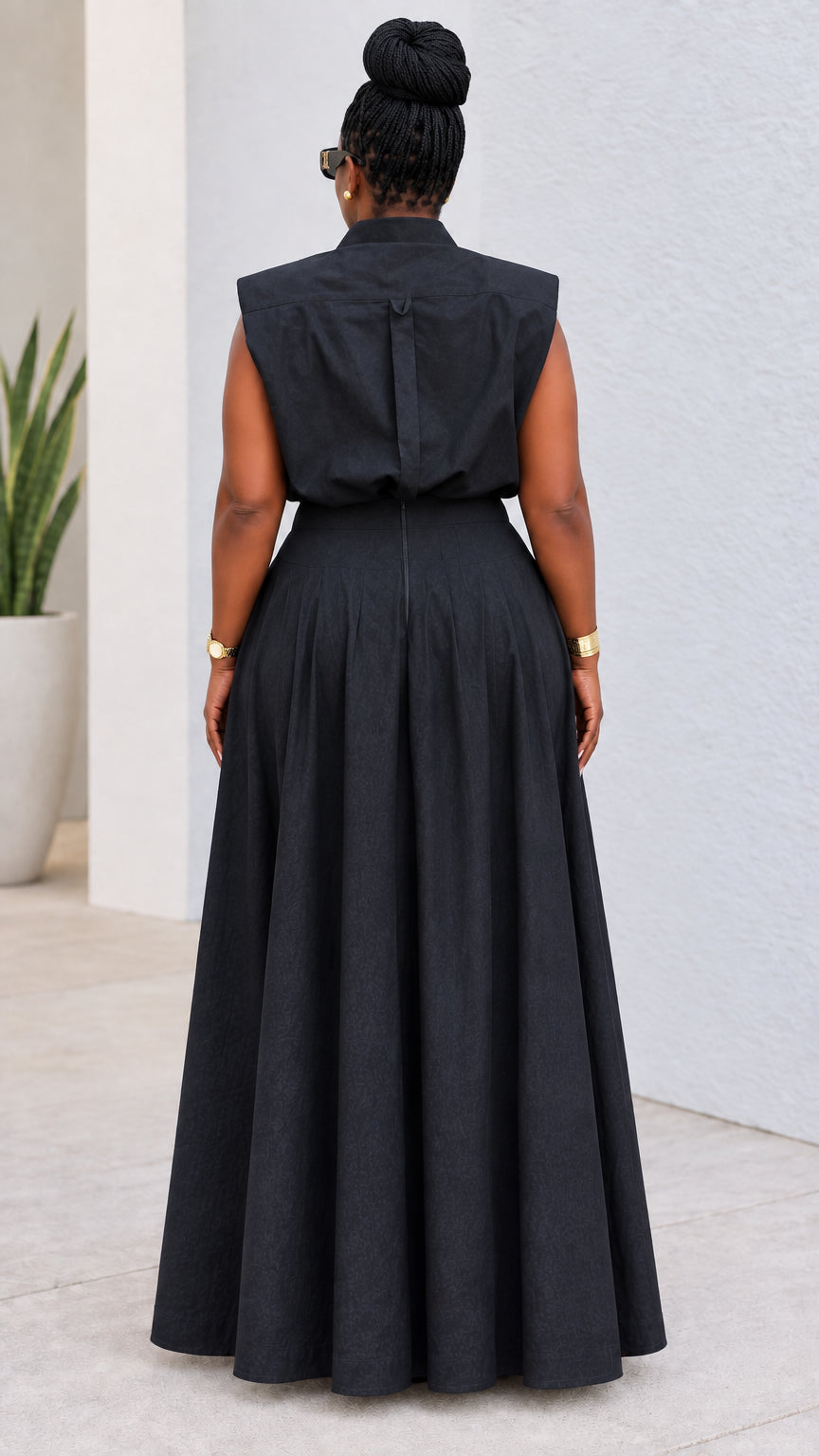 Back view of model wearing black two-piece wide-leg pant set