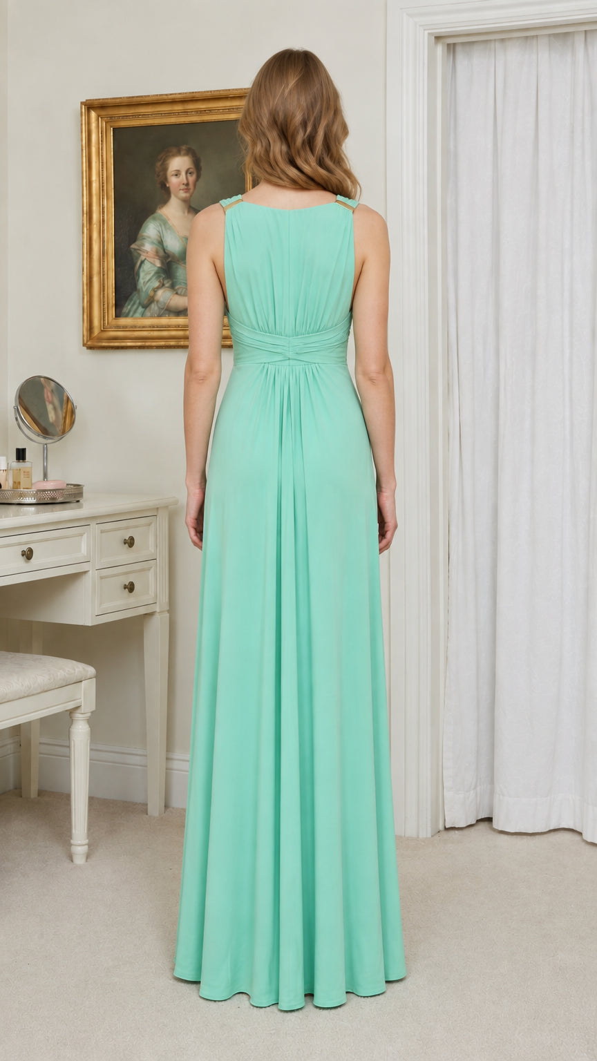 Back view of model wearing mint green pleated maxi dress showing draped back