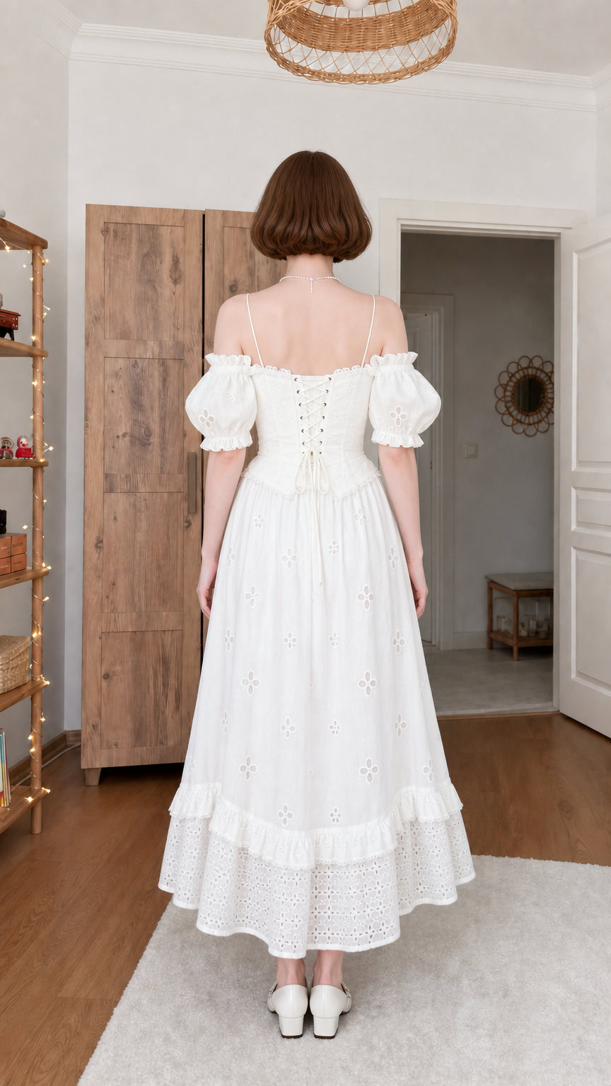 Back view of woman wearing white cottagecore corset midi dress with gathered skirt