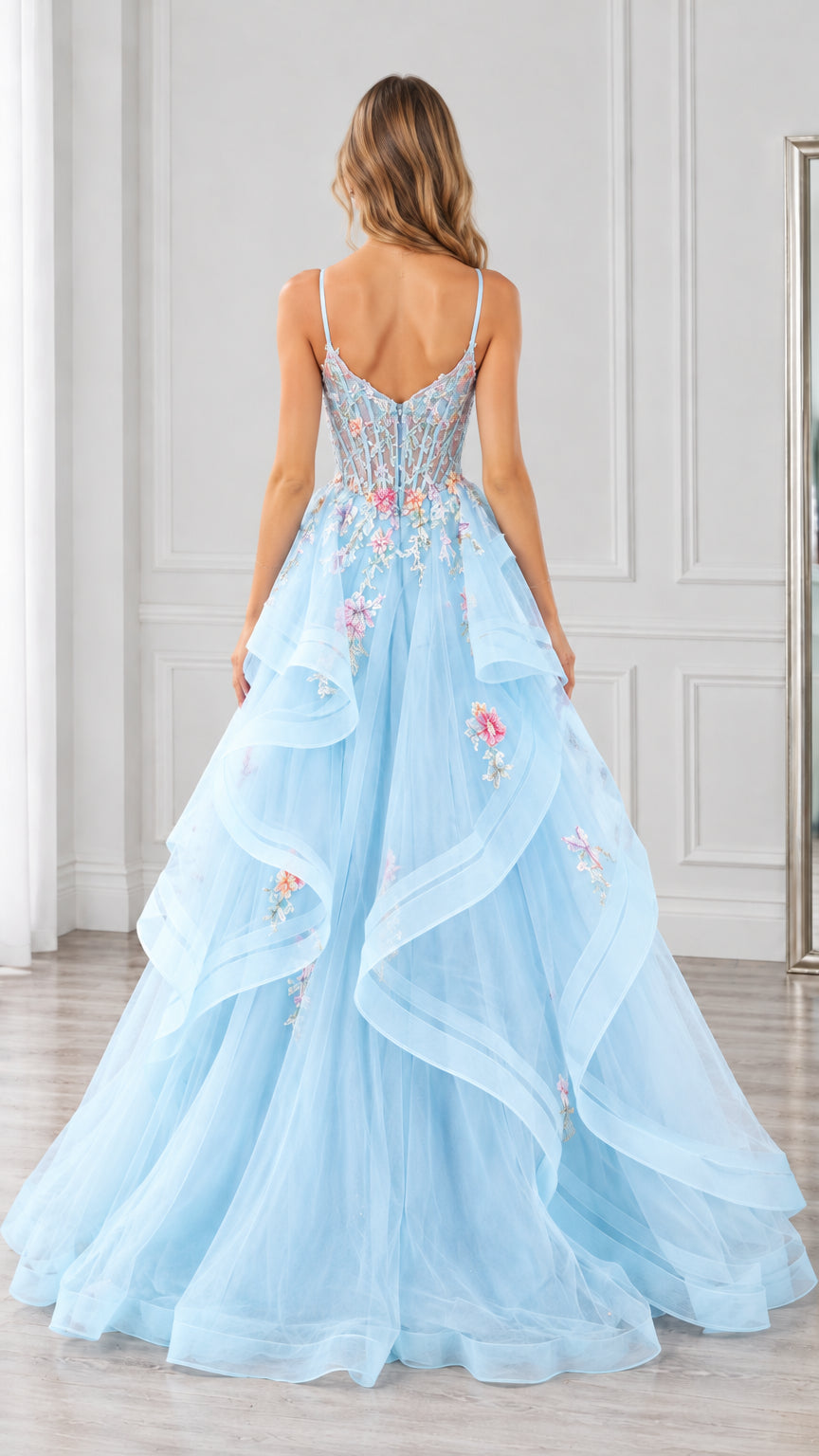 Back view of light blue floral embroidered ball gown showing spaghetti strap back