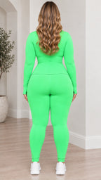 Back view of model wearing lime green zip jacket and leggings set