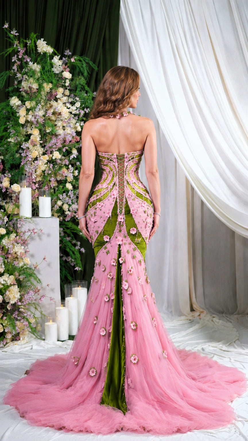 Rear view of pink and olive green formal evening gown showcasing lace-up corset back and sweeping train