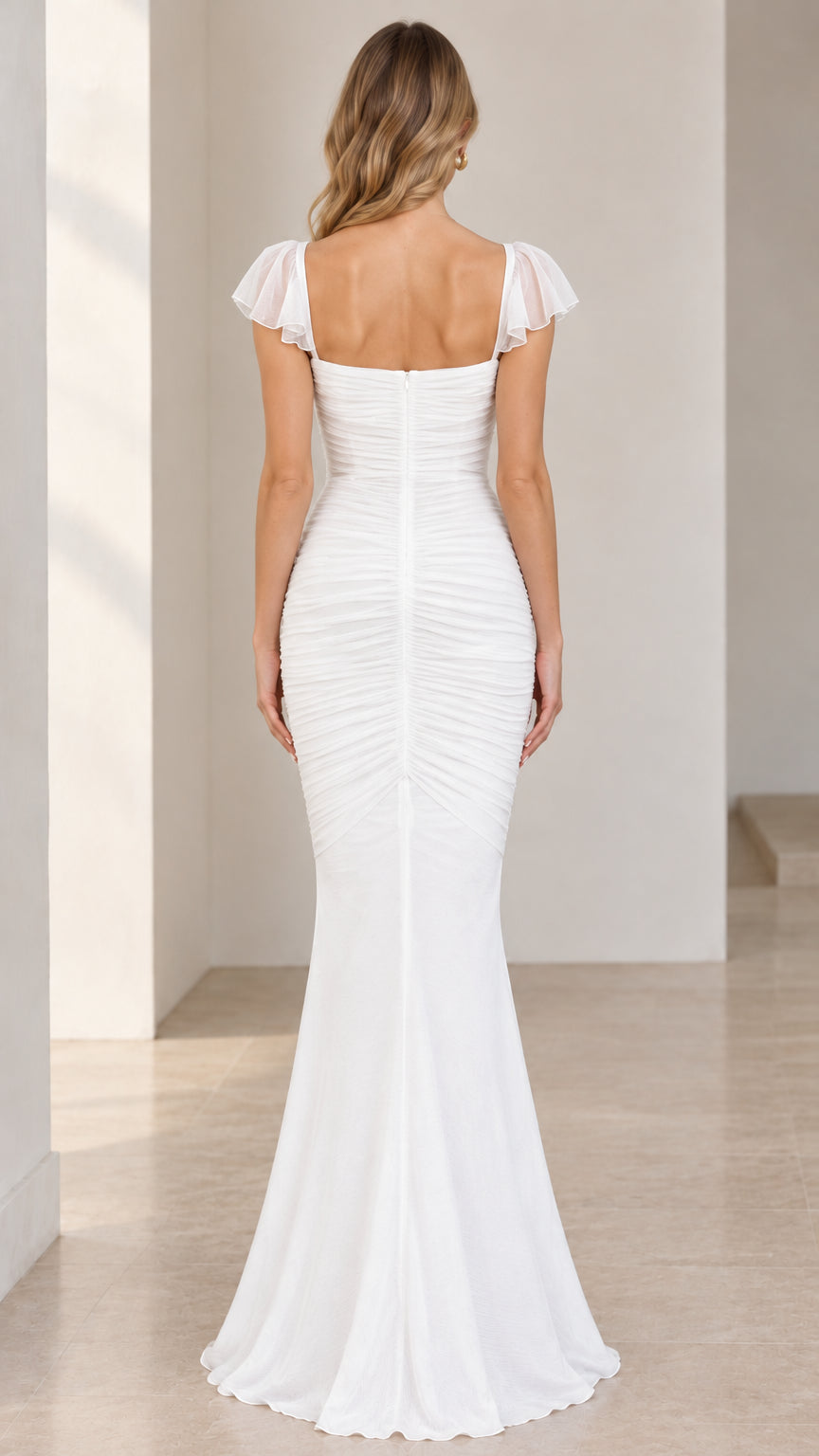 Back full-length view of white floor-length mermaid gown showing concealed zipper