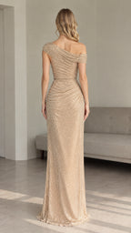 Back view of model in gold sequin one-shoulder maxi evening dress with gathered bodice