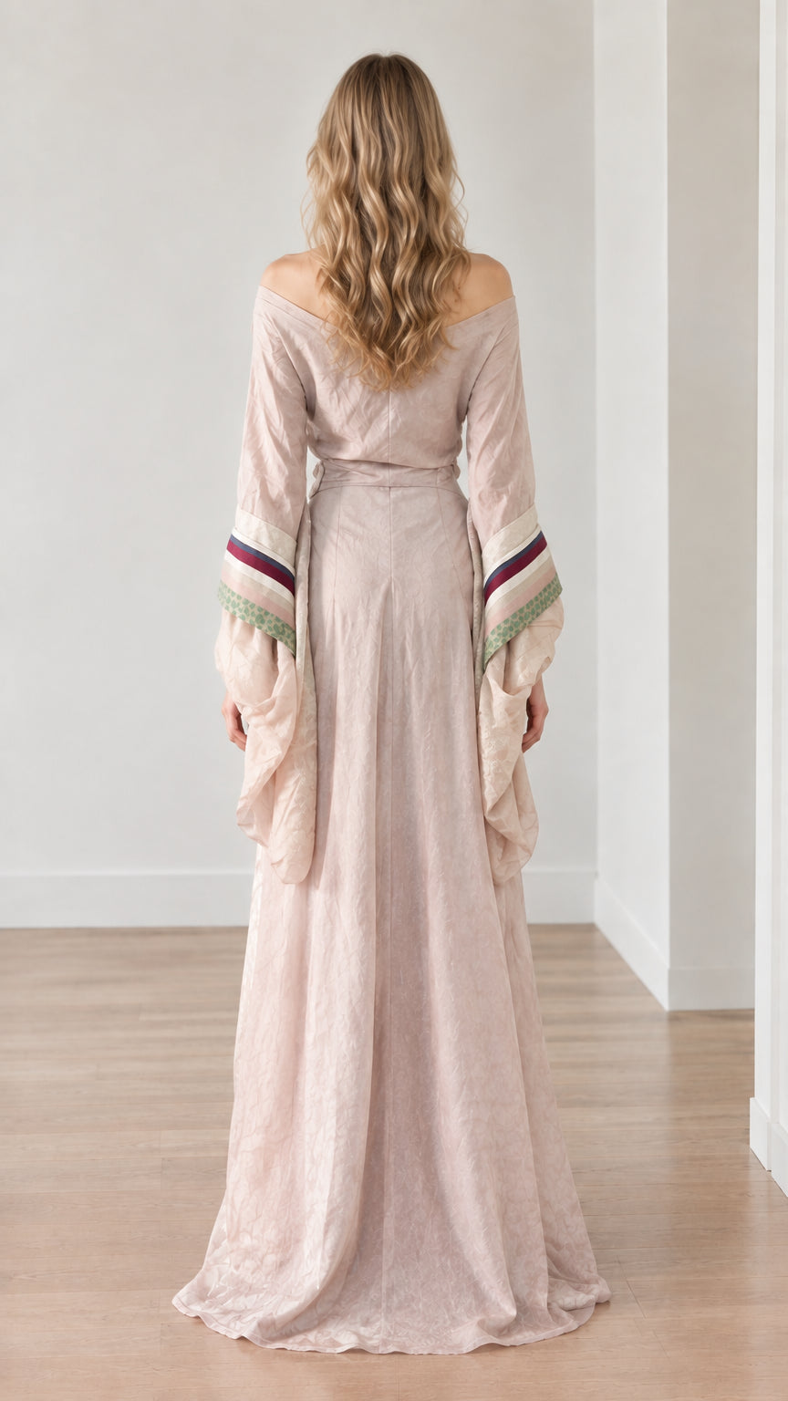 Back view of dusty pink medieval gown displaying floor-length sweep and wrap back