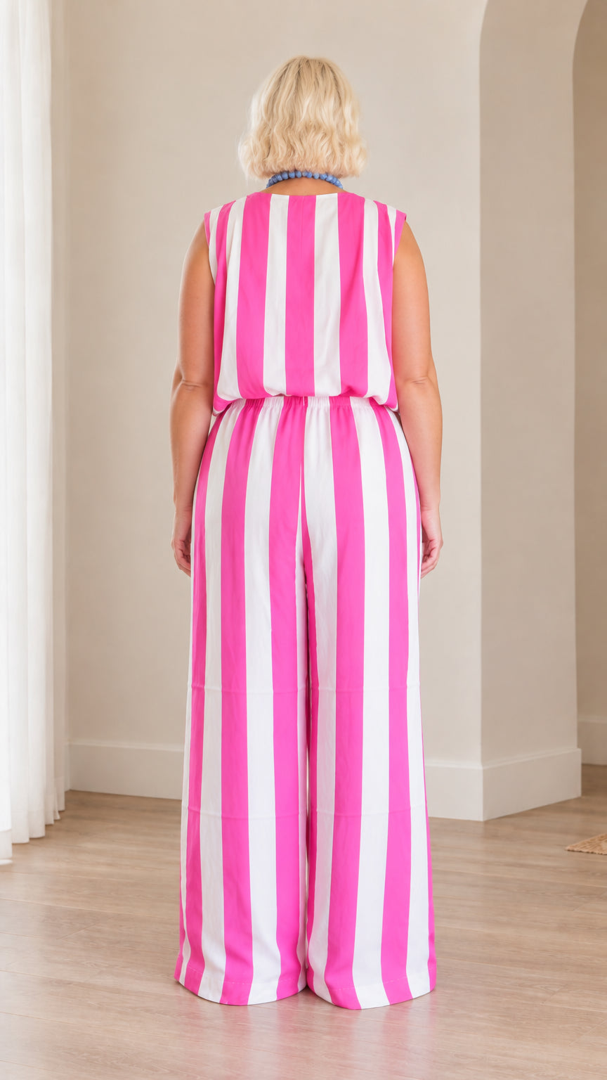 Back full view of woman wearing pink and white vertical striped matching set
