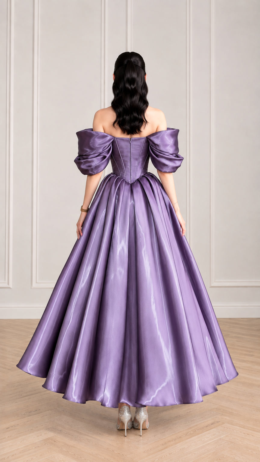 Back view of woman showing the gathered back skirt and corset bodice of purple satin evening gown
