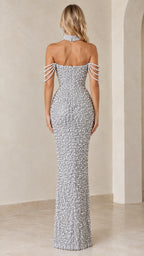 Back view of model showcasing the zip closure and fit of the silver pearl gown