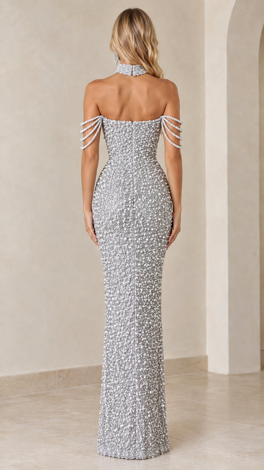 Back view of model showcasing the zip closure and fit of the silver pearl gown
