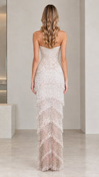 Back full-length view of champagne strapless beaded fringe tiered gown