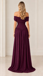 Back view of model in burgundy draped off-the-shoulder floor-length gown