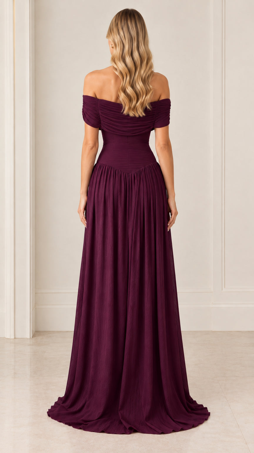 Back view of model in burgundy draped off-the-shoulder floor-length gown