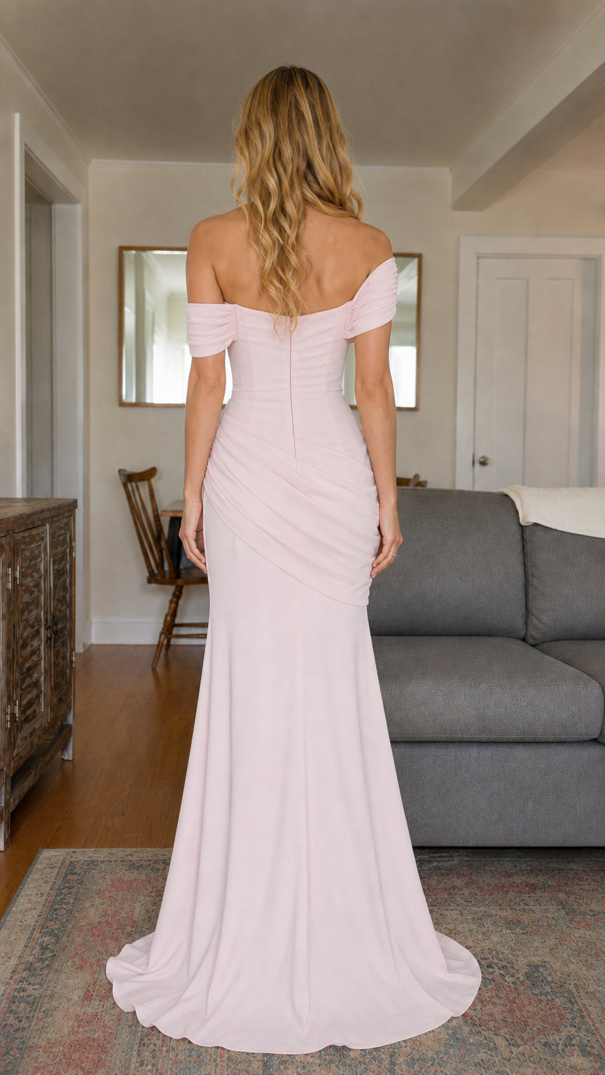 Back view of blush pink fitted mermaid evening dress with concealed zipper