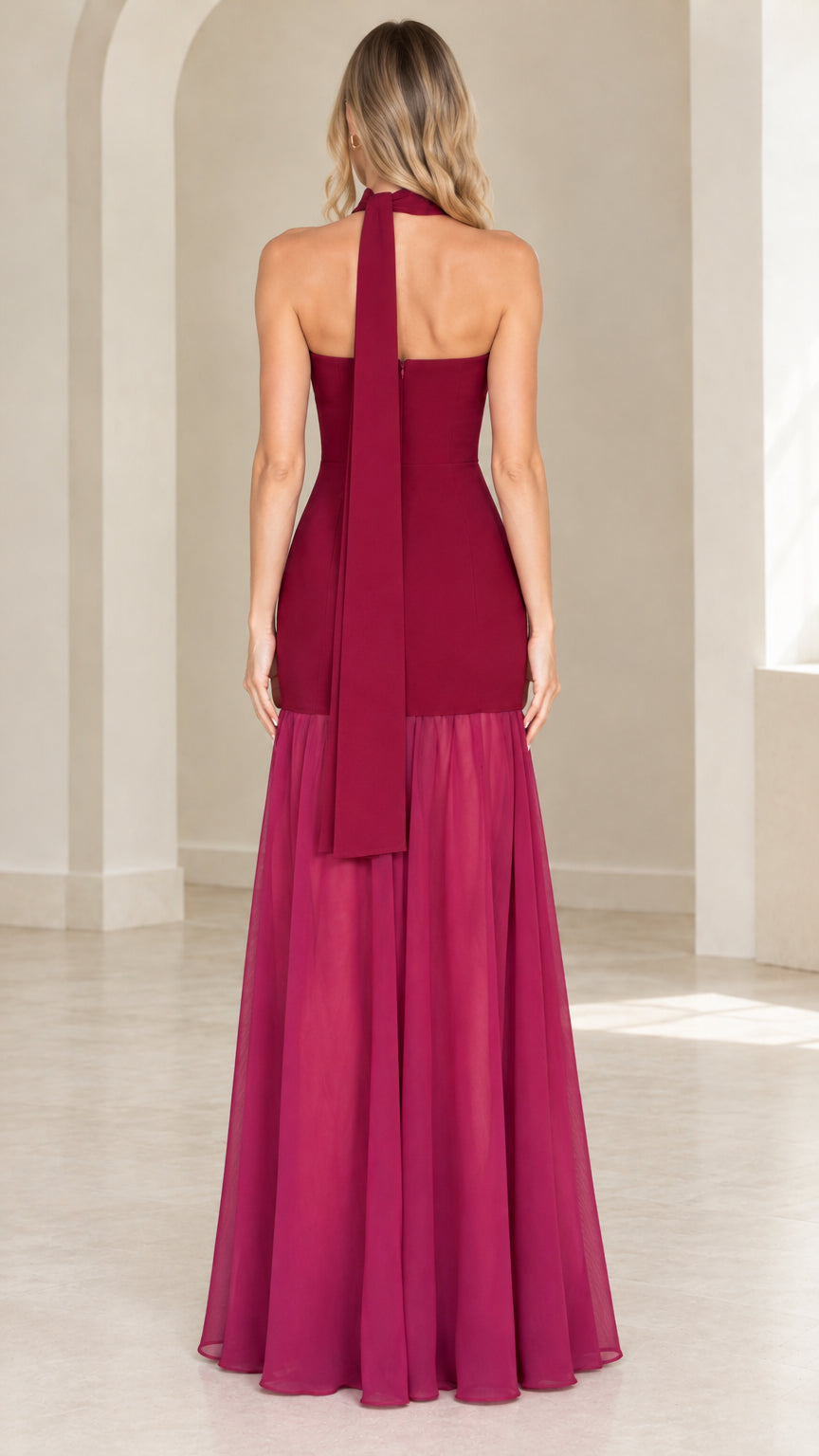 Back view of burgundy strapless maxi dress showing trailing scarf detail