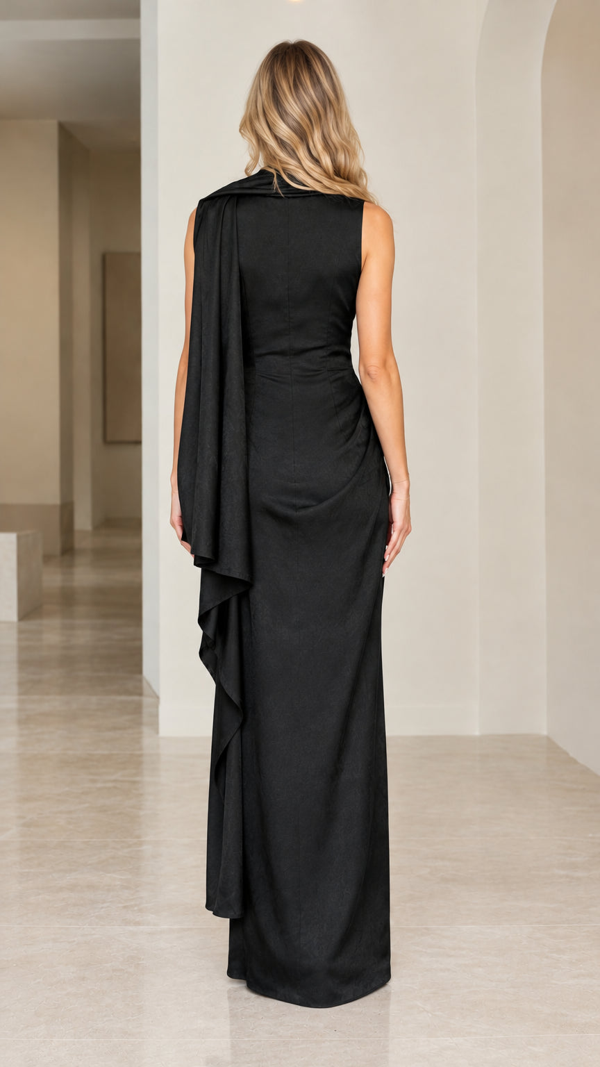 Back view of black sleeveless evening maxi dress highlighting shoulder drape and clean column silhouette