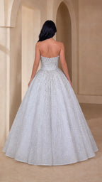 Back view of model in silver white strapless floor-length ball gown