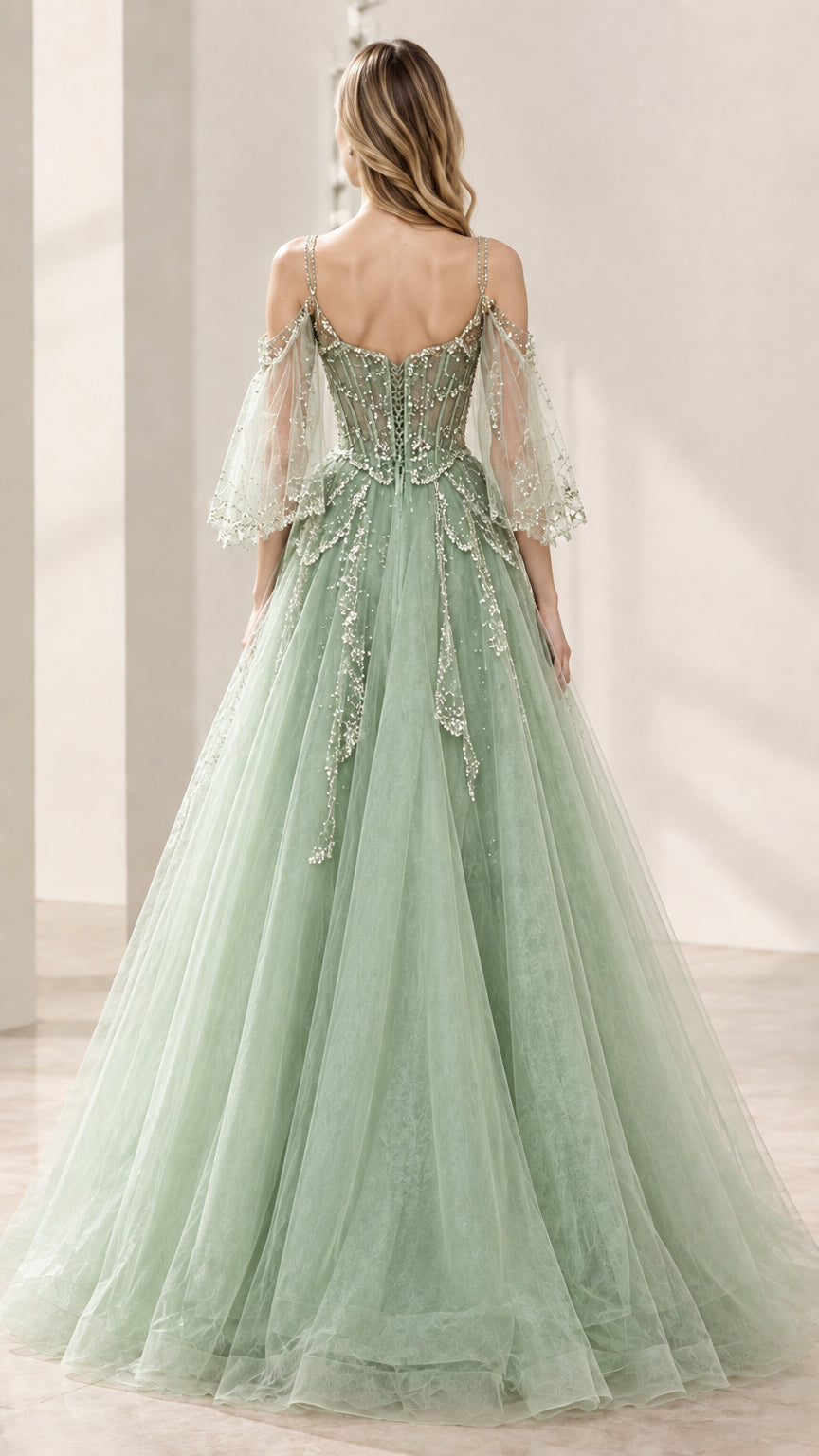 Sage green evening dress showing lace-up back and multi-layer tulle skirt