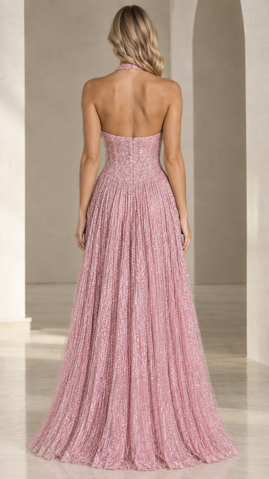 Back view of woman wearing backless pink halter sequin evening gown