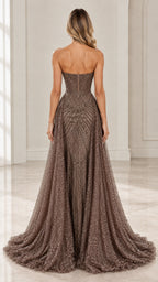 Back full-length view of mocha strapless gown showing zip closure and sweeping floor-length train