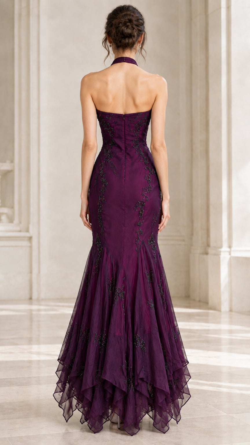 Back view of woman wearing plum halter evening dress with open upper back detail