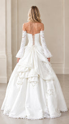 Back view of ivory corset gown highlighting lace-up tie closure and bustle drape