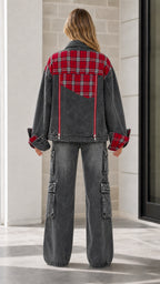 Back view of model showing red tartan plaid back yoke on the Washed Black denim jacket