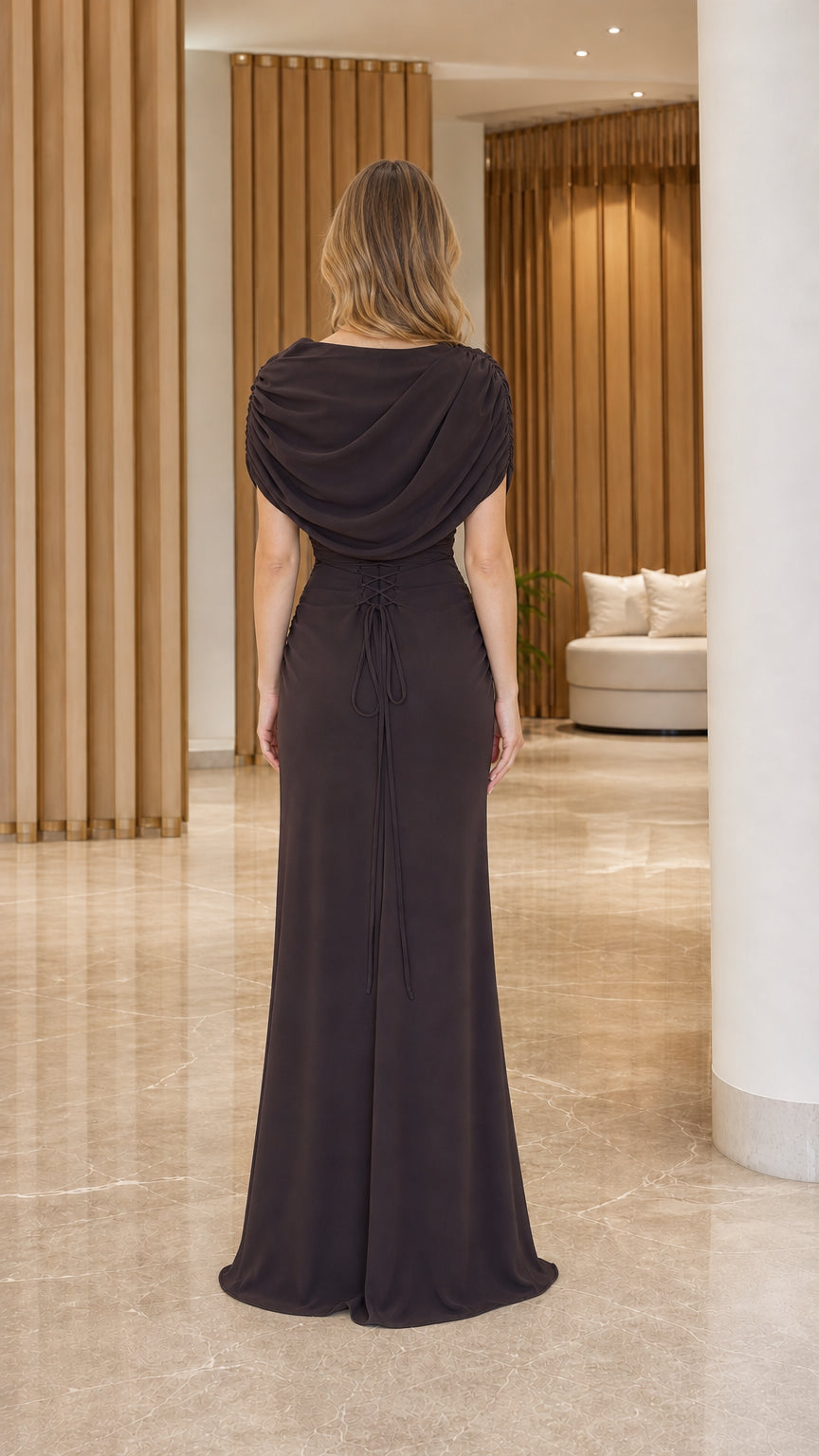 Back view of model showing cowl back and tie detail on espresso brown evening gown