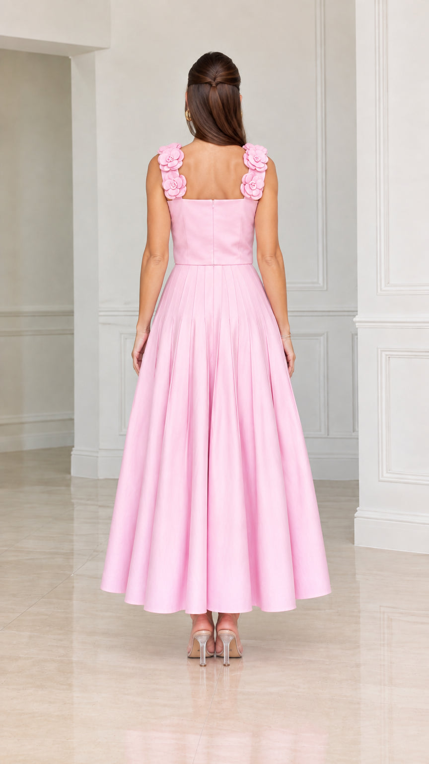 Back view of woman wearing pink square back pleated midi cocktail dress