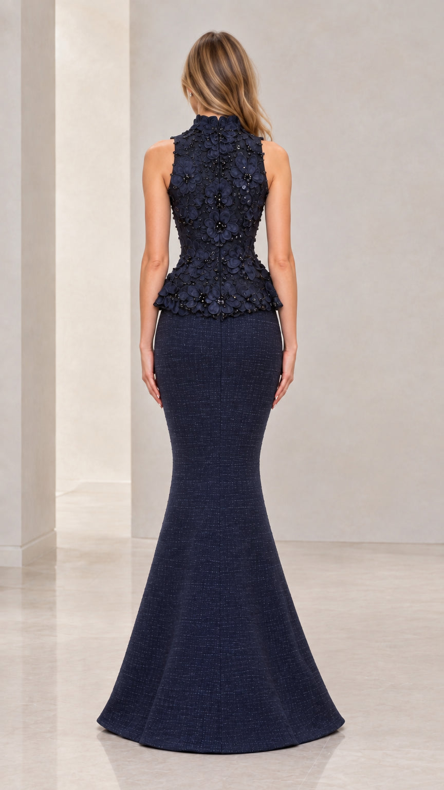 Back view of Navy Blue high-neck peplum evening gown showing zipper and fit