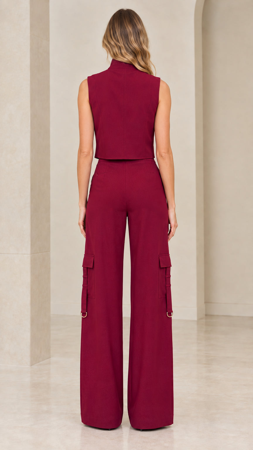 Back view of model wearing burgundy sleeveless high-neck top and wide-leg pants