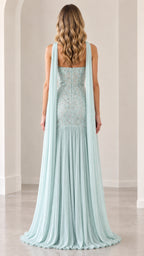 Back view of mint green strapless evening gown displaying trailing scarf cape and back pleating