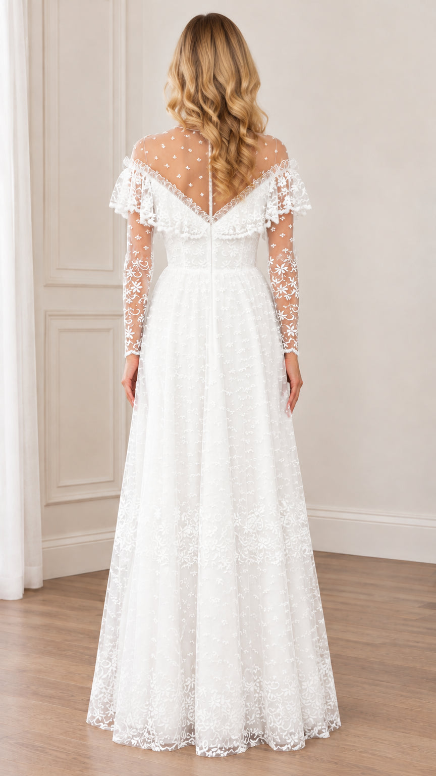 Back view of woman wearing white long-sleeve embroidered lace gown with illusion back
