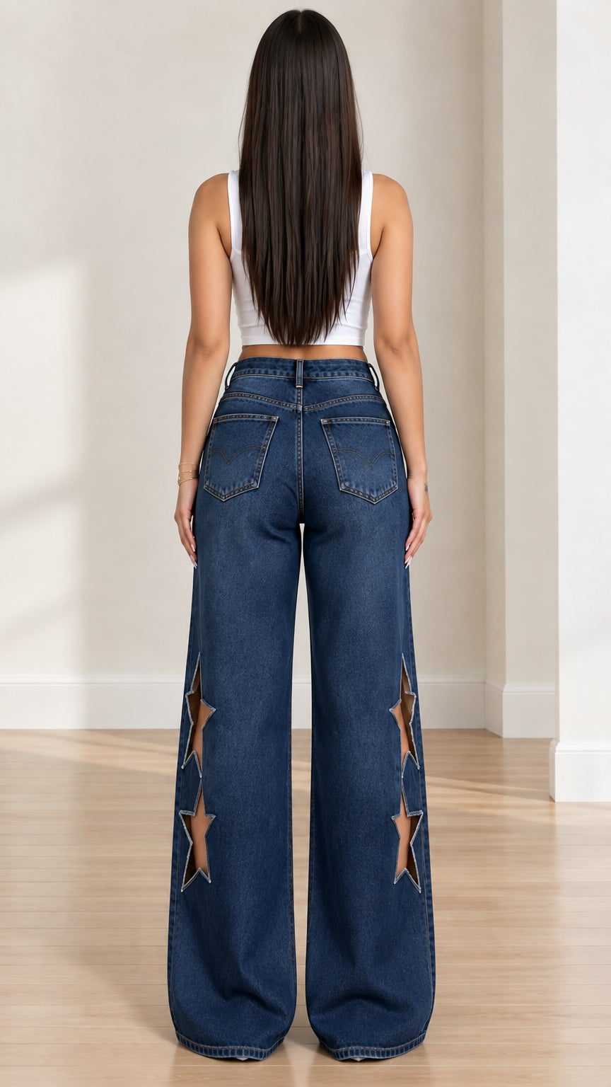 Rear view of dark blue high-rise wide-leg jeans with star cutouts