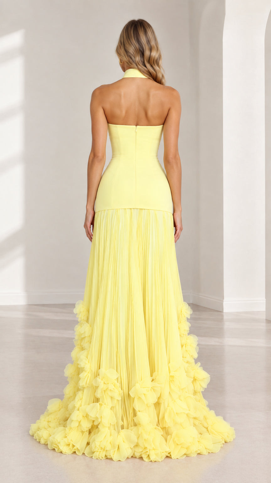 Back view of yellow asymmetric evening dress showing straight backline and flowing hem