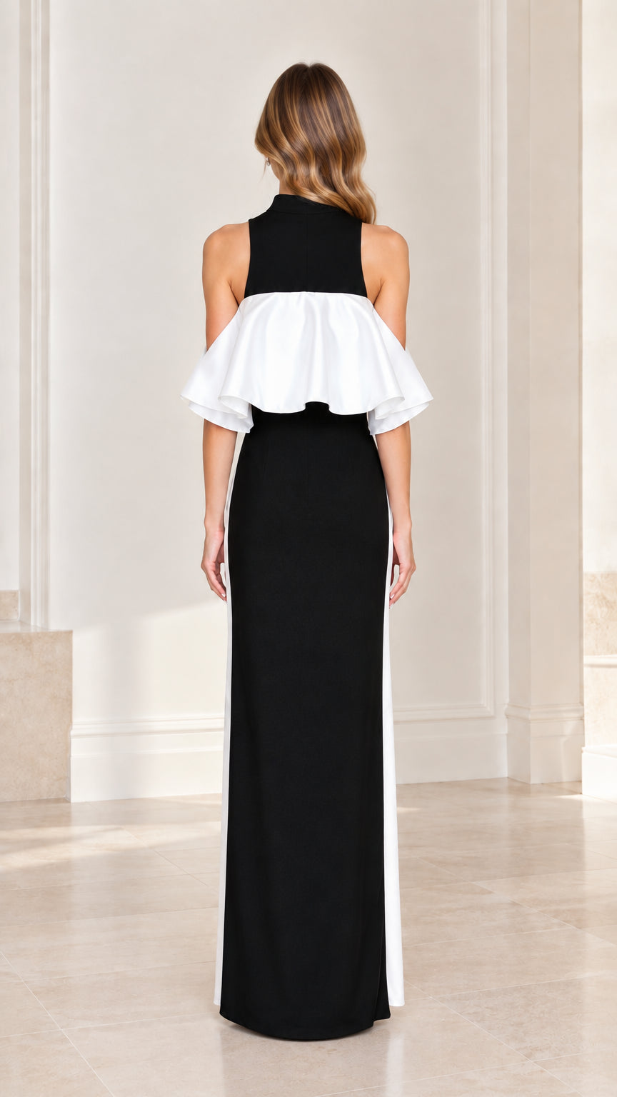 Back view of model wearing high neck ruffle overlay column maxi dress in black