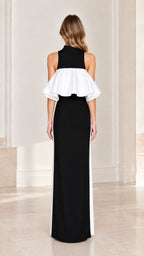 Back view of model wearing high neck ruffle overlay column maxi dress in black