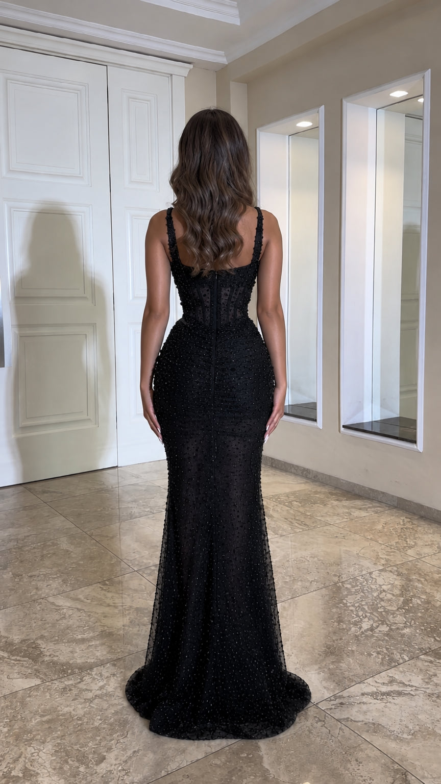 Back view of black floor-length sequin evening gown with sweetheart back