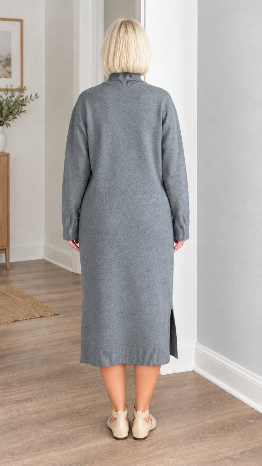 Back view of woman wearing slate grey long sleeve knit sweater dress