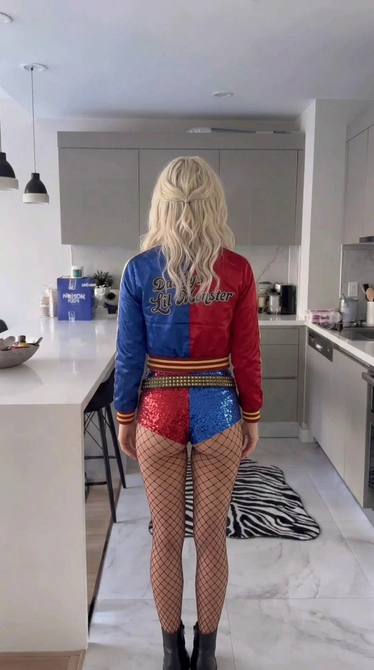 Back view of woman showing the split red and blue jacket back embroidery and sequin shorts