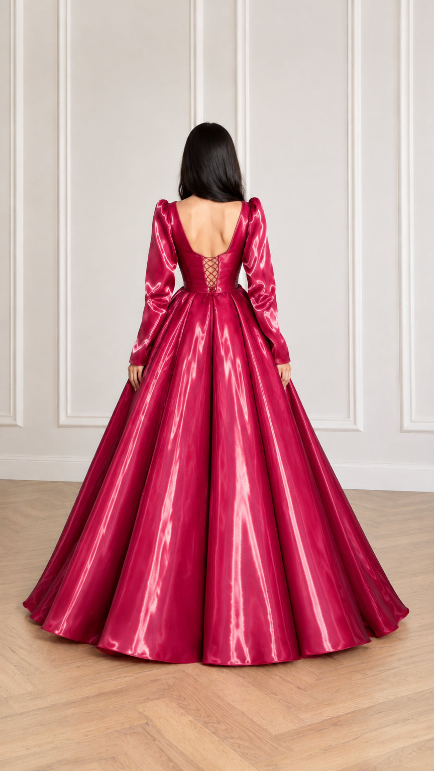 Rear view of magenta evening gown highlighting the lace-up corset back and voluminous skirt