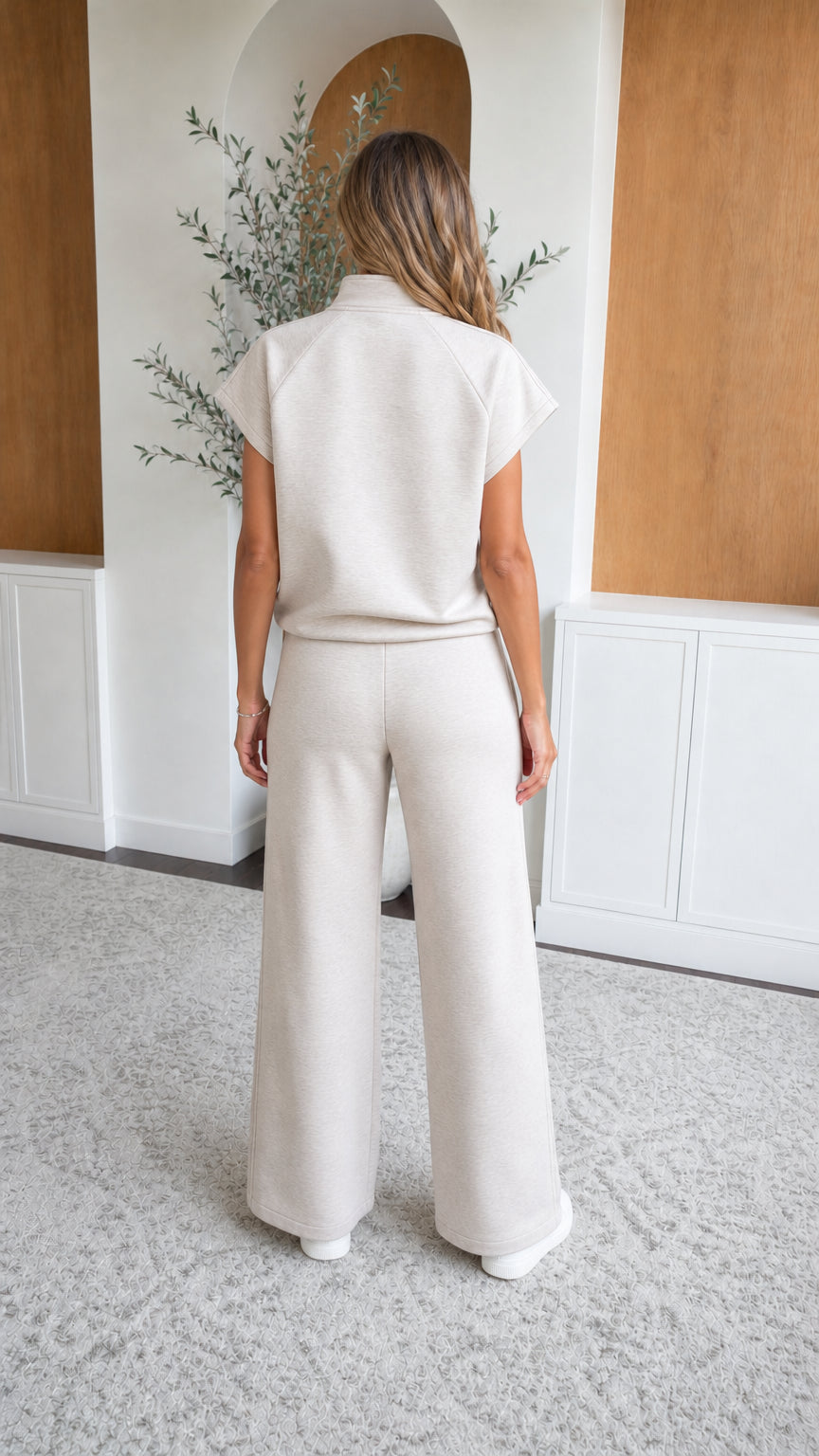 Back view of woman wearing oatmeal wide leg pant and top loungewear set
