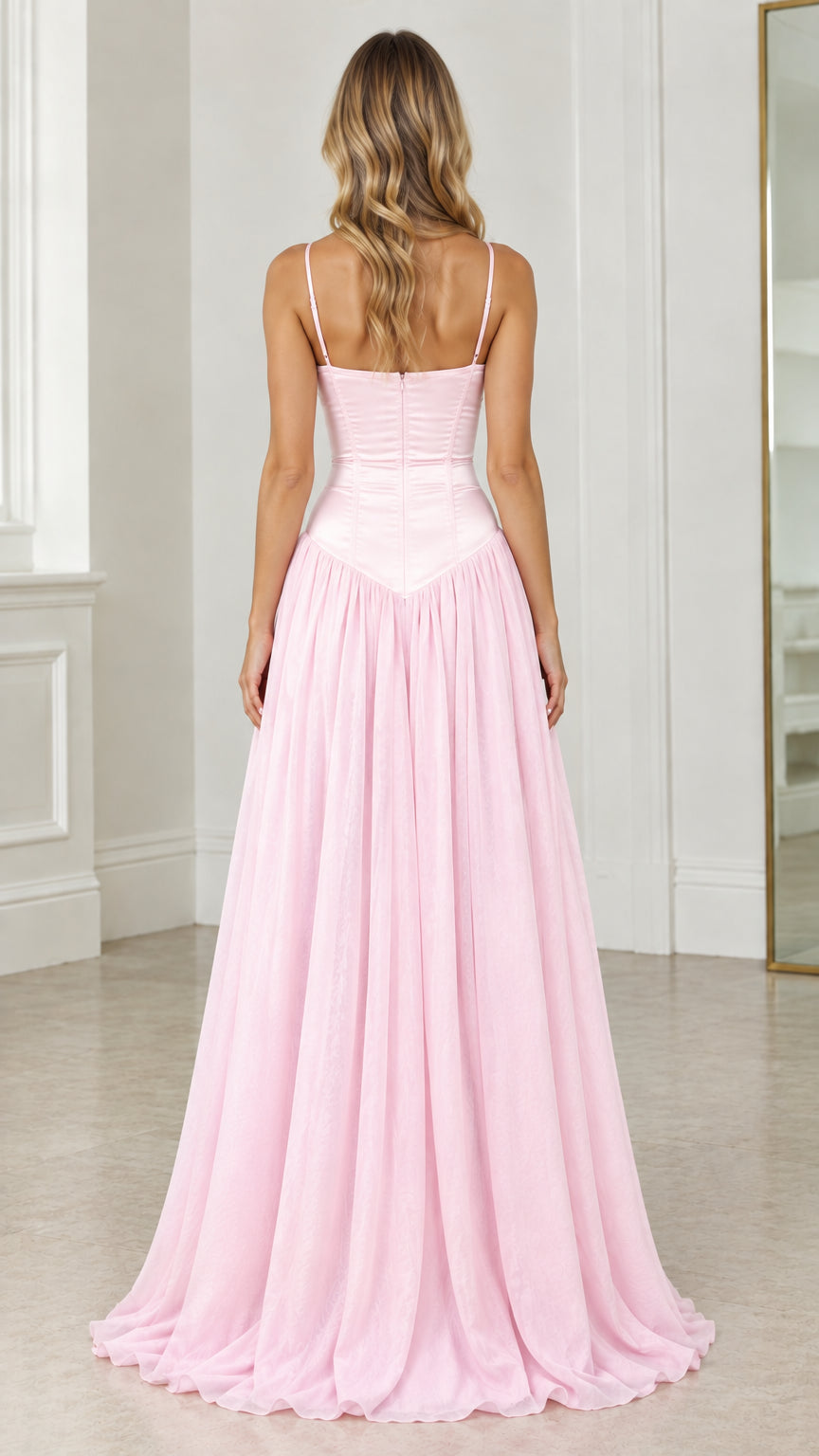 Back view of model showcasing pink corset back and flowing floor-length skirt