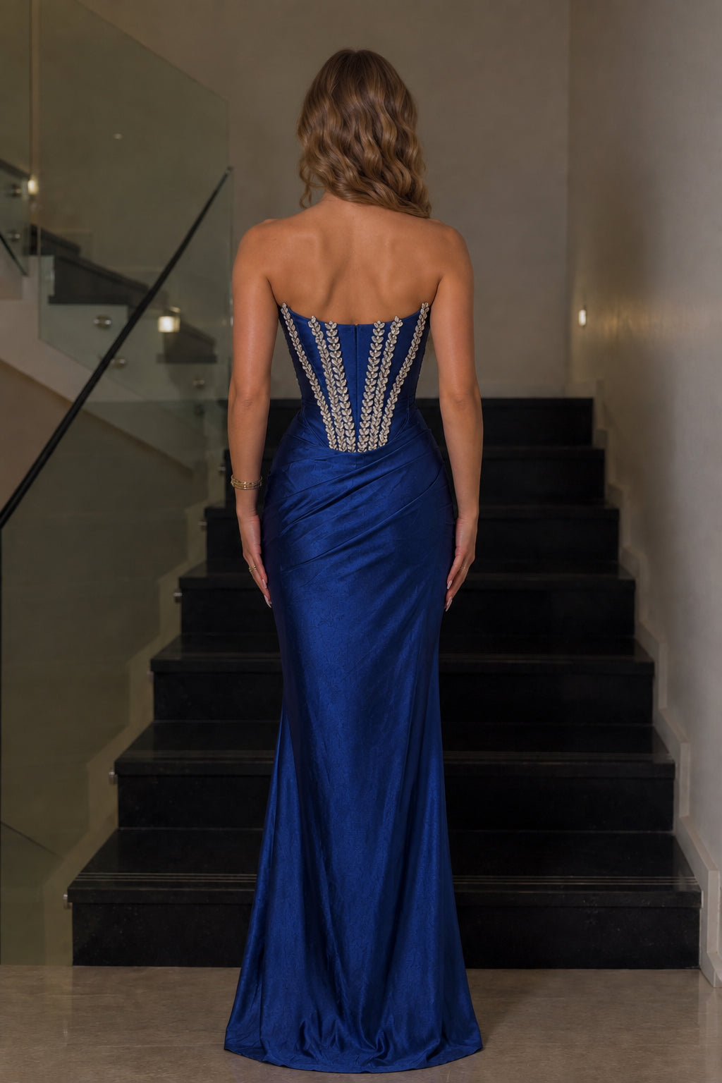 Back view of royal blue corset maxi dress with embellished boning