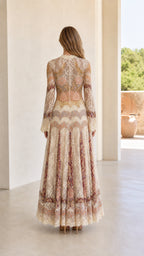 Back view of model wearing cream long sleeve lace evening maxi gown