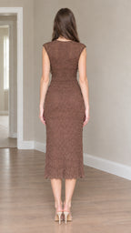 Back view of woman wearing brown cap sleeve midi bodycon dress